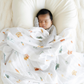 Baby boy with Van Life Bamboo Rayon Muslin Saranoni soft swaddle.