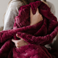 Add a touch of elegance to your home with this deep red patterned faux fur blanket from Saranoni. This soft blanket features a luxurious texture and adds a cozy aesthetic. Enjoy this durable throw blanket for years to come!