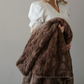 A brown patterned faux fur blanket that is a throw blanket. This Saranoni blanket is luxuriously soft and can be used as home decor, for gifting, or for relaxing. Enjoy this luxury blanket for years to come!