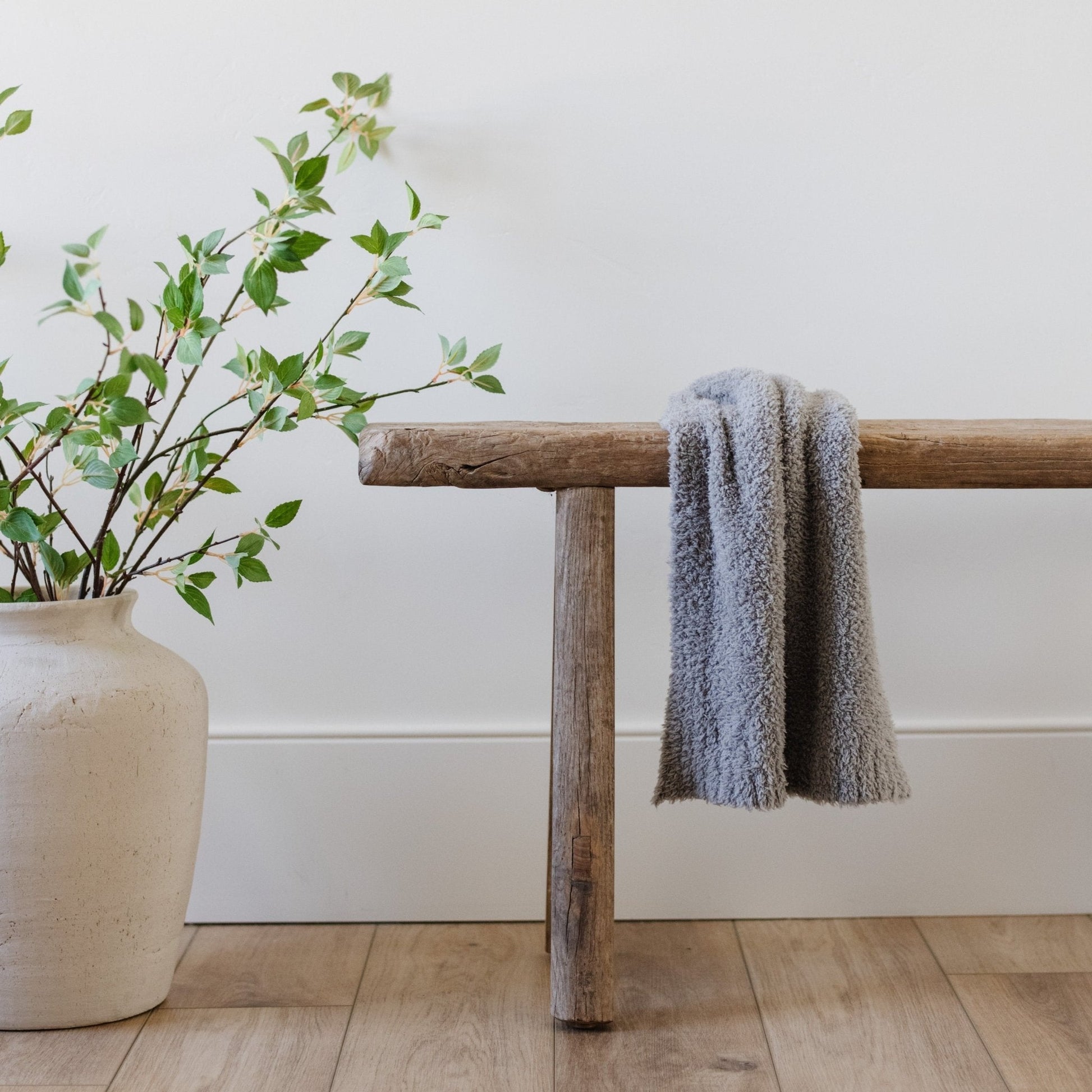 Adorable mini blanket set on wooden bench in beautiful house - BAMBONI® MINI BLANKETS - Saranoni