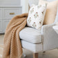 XL tan waffle knit blanket draped across chair.